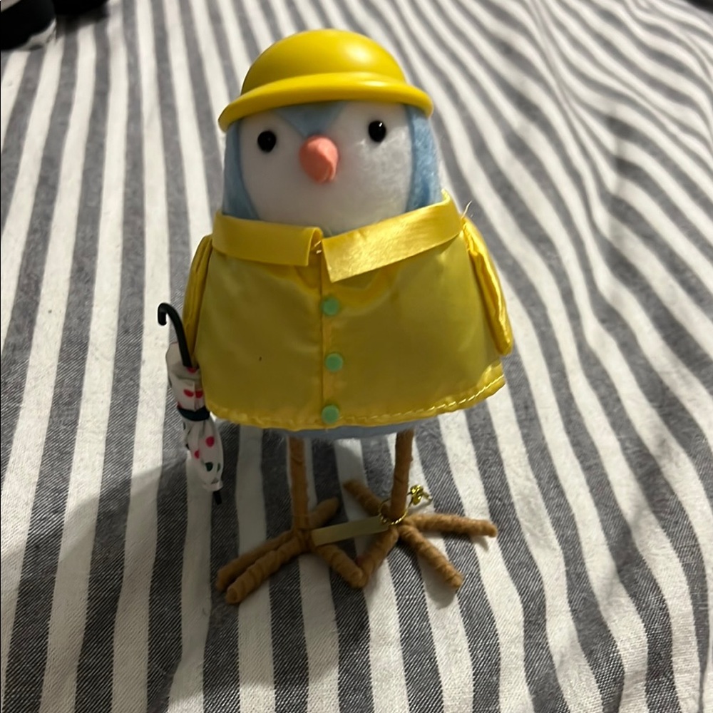 Yellow Raincoat Bird Figurine